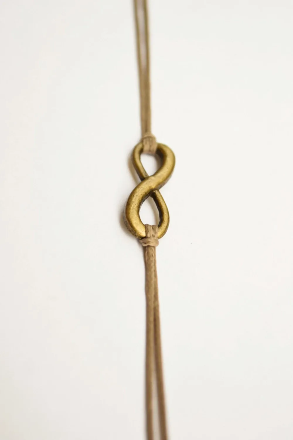 Infinity bracelet, brown cord bracelet with a bronze charm, yoga gift for her